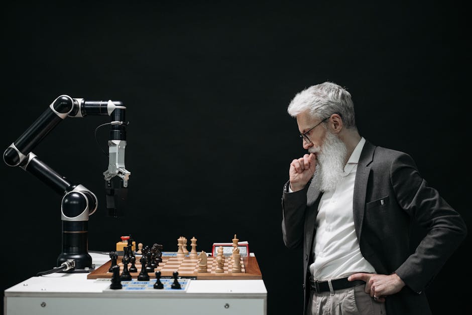 An elderly scientist contemplates a chess move against a robotic arm on a chessboard.